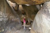 Joylani under a pile of boulders